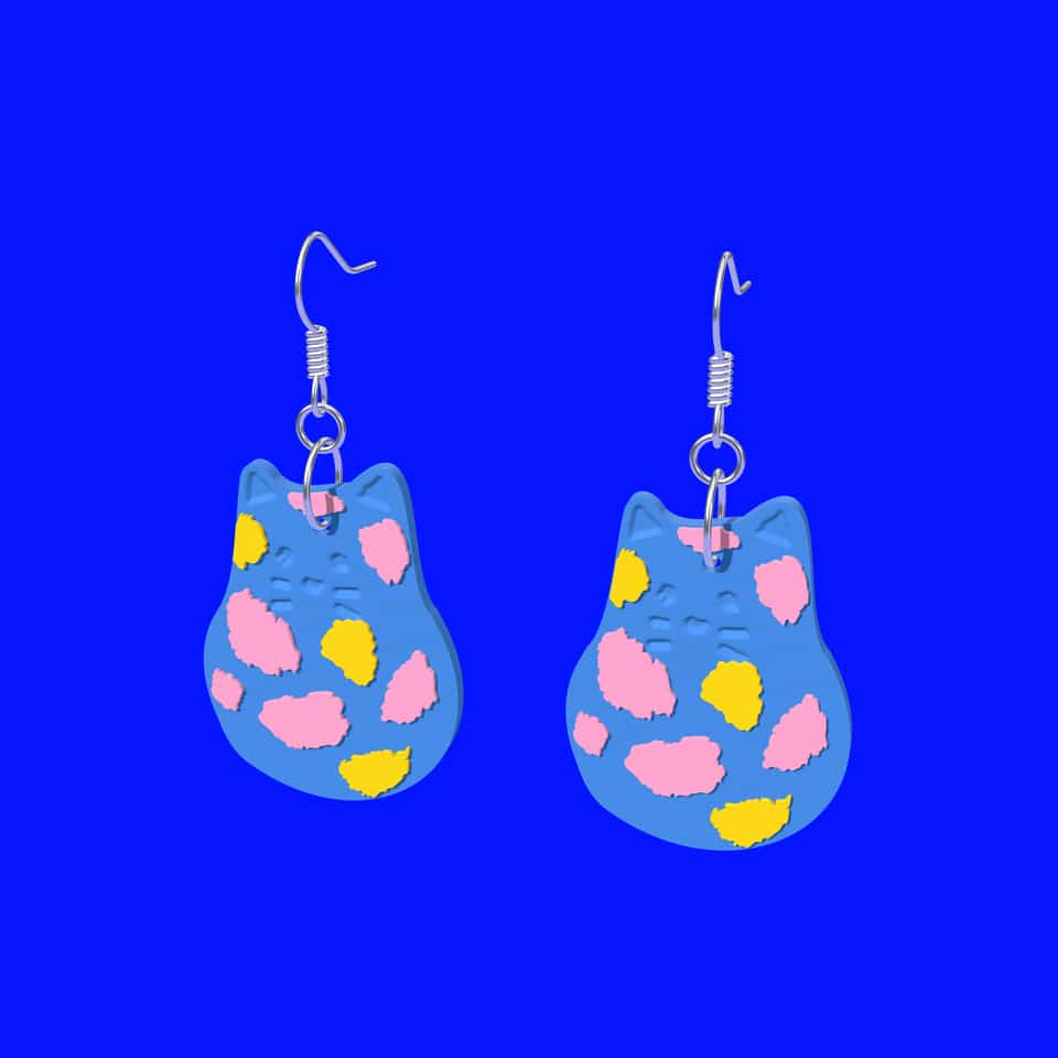 A pair of 40 mm Blue Spotted Cat drop earrings on ear wires.