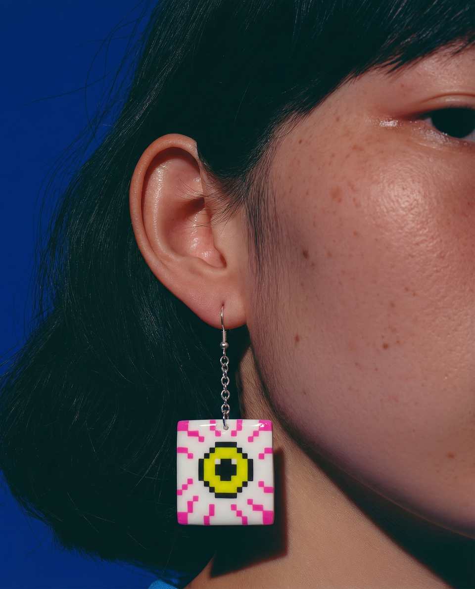 White Polymer Clay Pixel Eyeball Tile Dangle Earrings shown in styled wear context with size, drape, and hardware visible. Earrings using pixel construction, finished with gloss s…