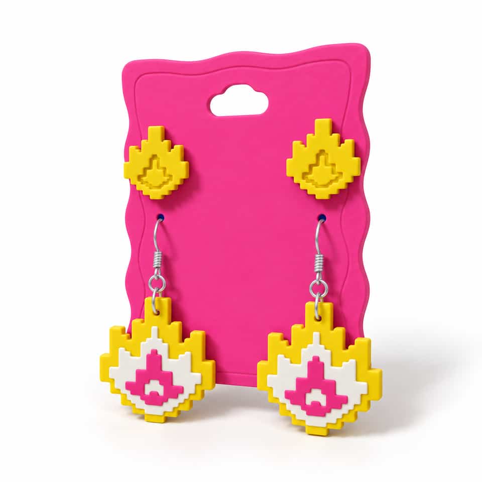 Front of a pink Large clay card with compact yellow relief studs above yellow, cream and pink layered dangles.
