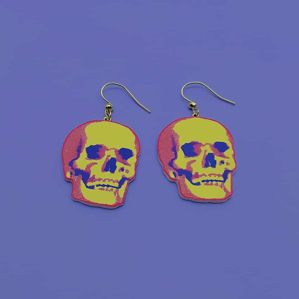 Polymer Clay Halftone Skull Statement Dangle Earrings. Earrings made with slab cutting with a matte sealant finish. Roll two thin slabs to even thickness, pull a silkscreen pass f…