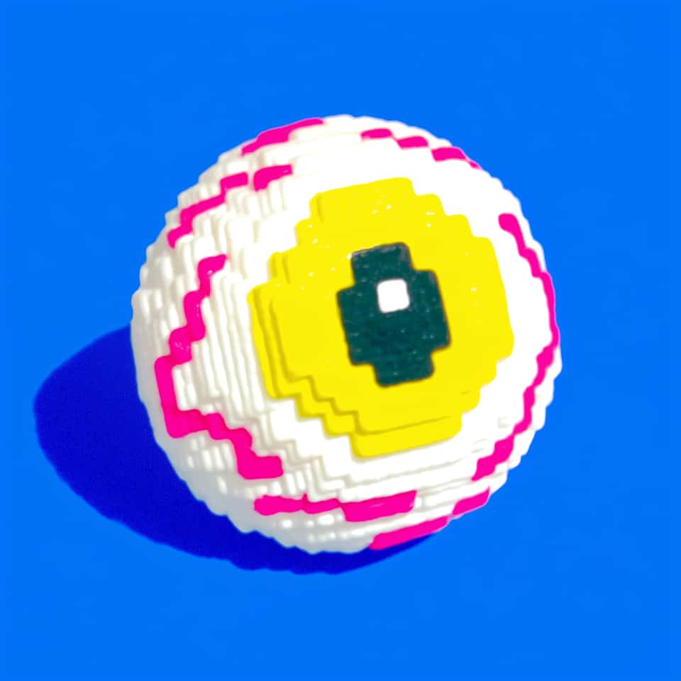 Polymer clay pixel eyeball brooch built from stacked stair-edged white layers forming a stepped dome, with a stepped yellow iris, a dark teal plus-shaped pupil with a white square…