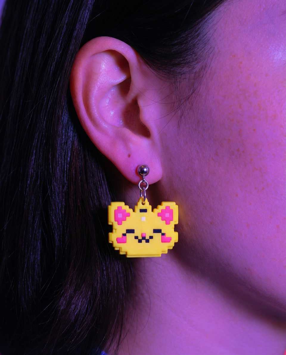 Yellow Polymer Clay Pixel Cat Face Dangle Earrings shown in styled wear context with size, drape, and hardware visible. Pixel construction earrings with a sanded buffed finish.