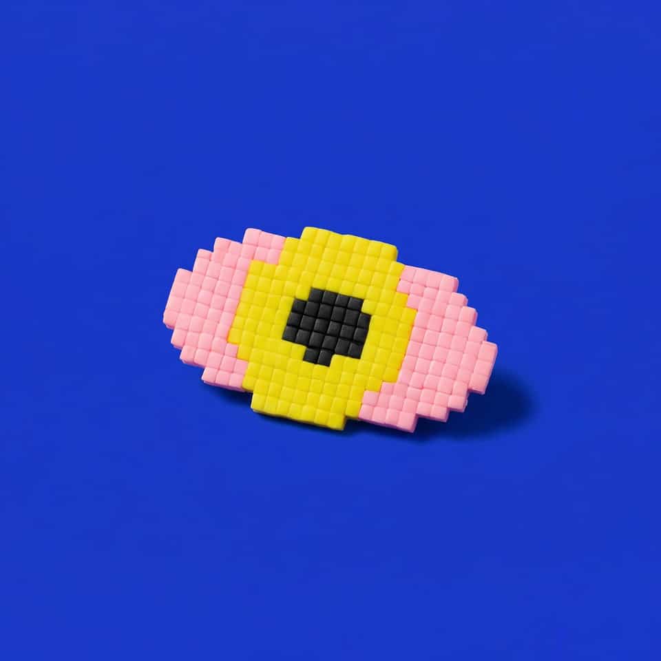 Pink Polymer Clay Pixel Eye Tile Pin. Handmade brooch using pixel construction with a sanded buffed finish. A pink pixel eye brooch built from small clay squares: place tiles, sli…