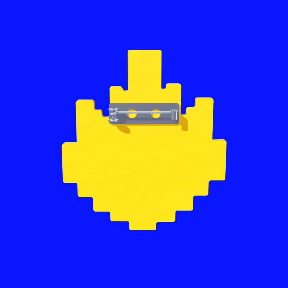 The plain back of the layered flame with its glued-on bar pin.