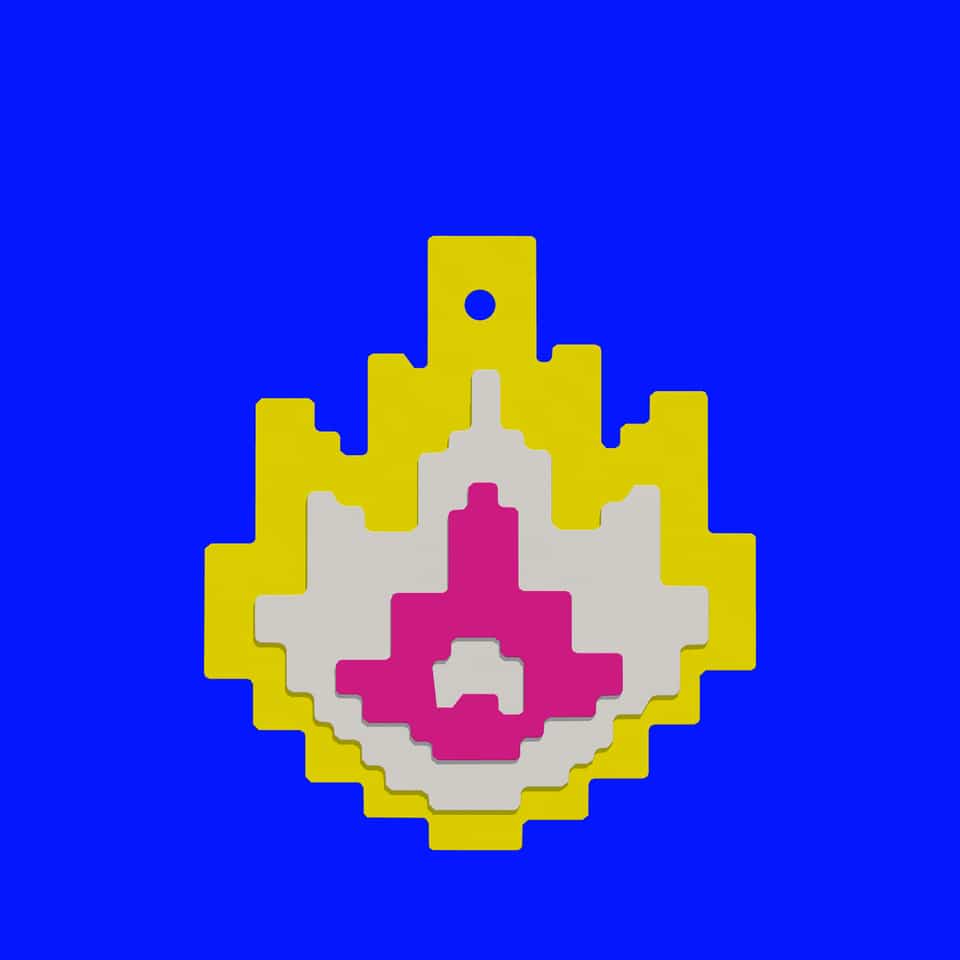 The hanging hole goes through the top of the yellow flame base.