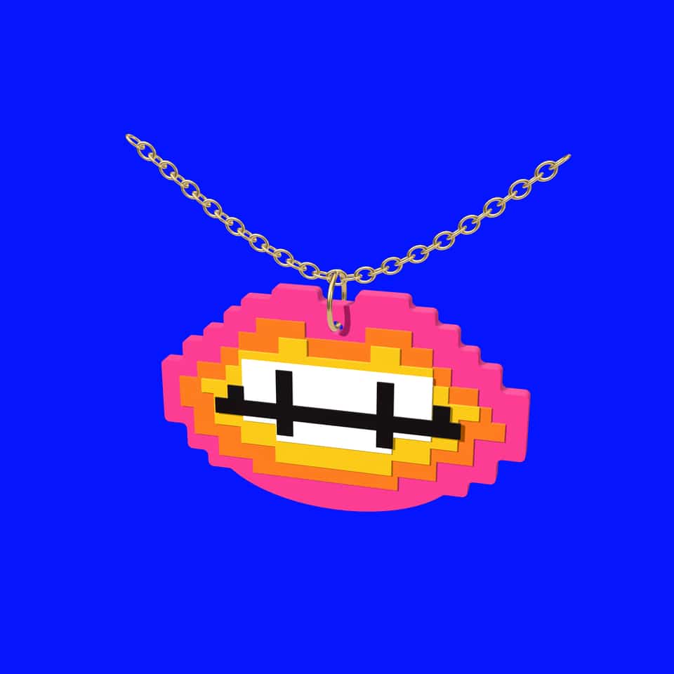 A layered Pixel Lips pendant hanging from a jump ring on a chain.