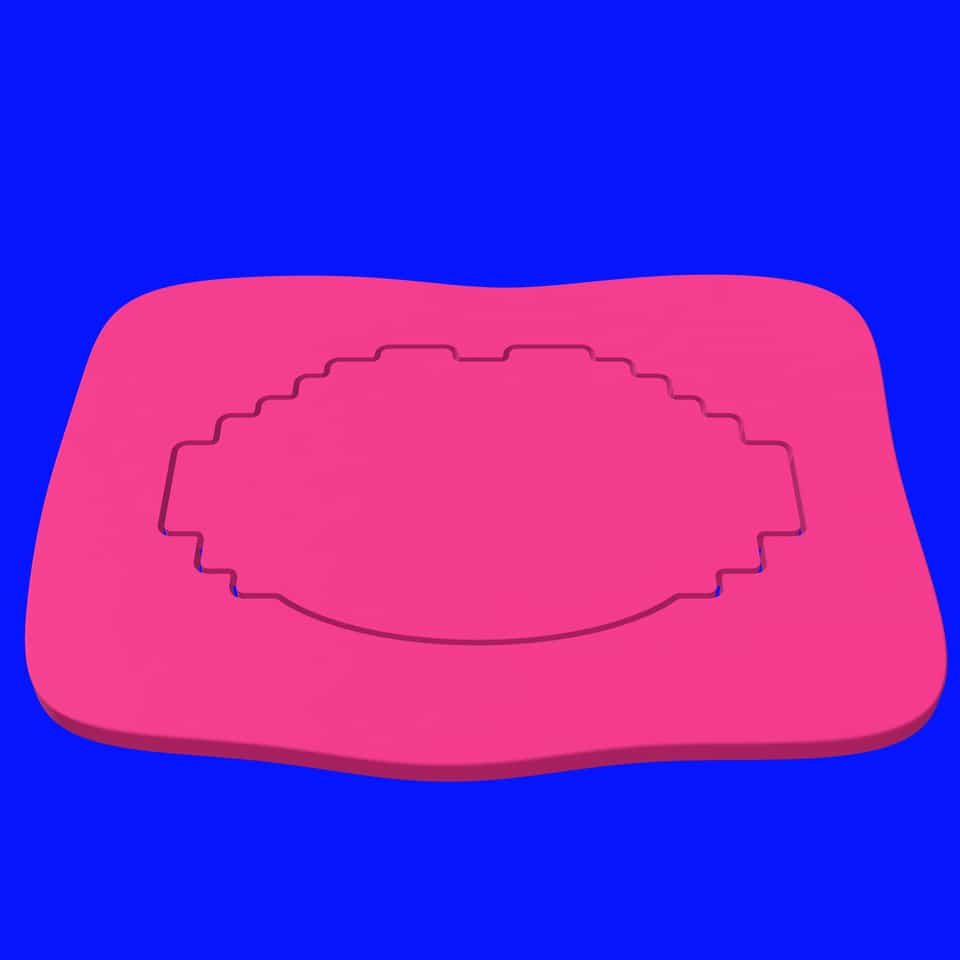 Lift the base cutter straight up; the lips outline stays cut into the pink slab, ready to peel away the extra clay.