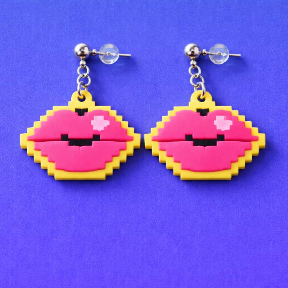 Hot Pink Polymer Clay Pixel Lips Dangle Earrings. Earrings made with pixel construction with a sanded buffed finish. Mirrored hot-pink lips read clean when the yellow staircase bo…