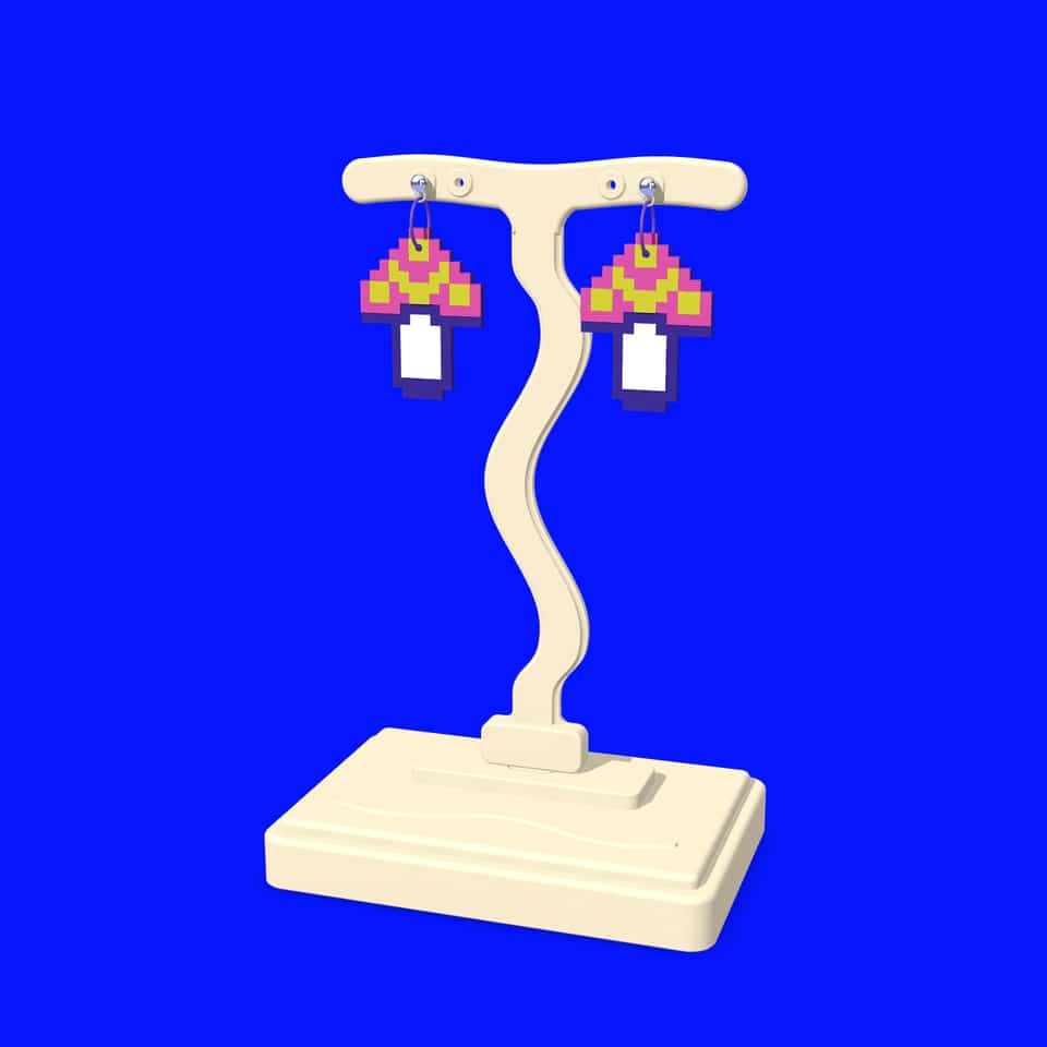 Pixel Mushroom drop earrings hanging from a printed T-bar display stand.