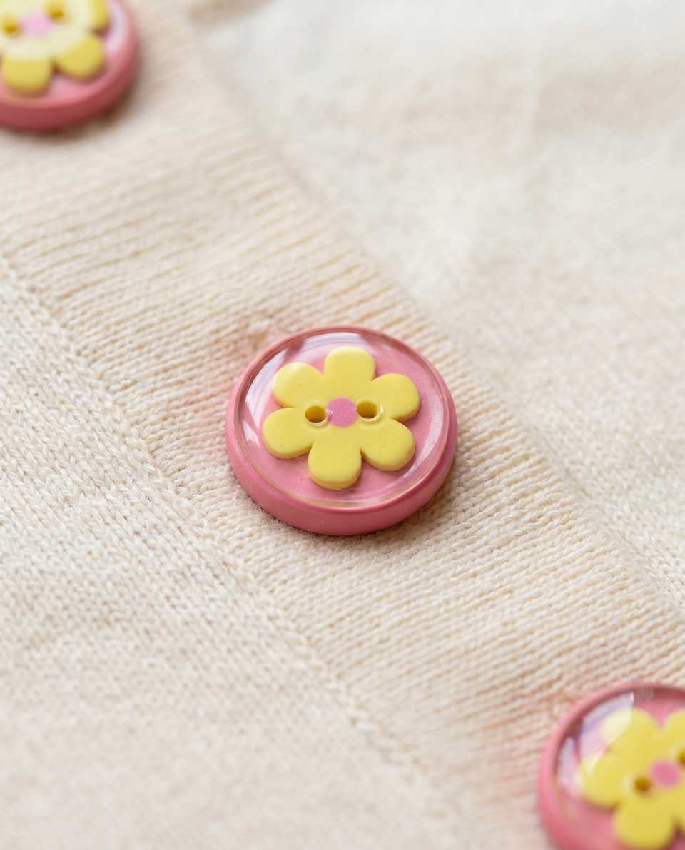 Pink Polymer Clay & Yellow Flower Dome Button Set shown in styled display context with object size and surface texture visible. Button made with surface effects with a gloss seala…