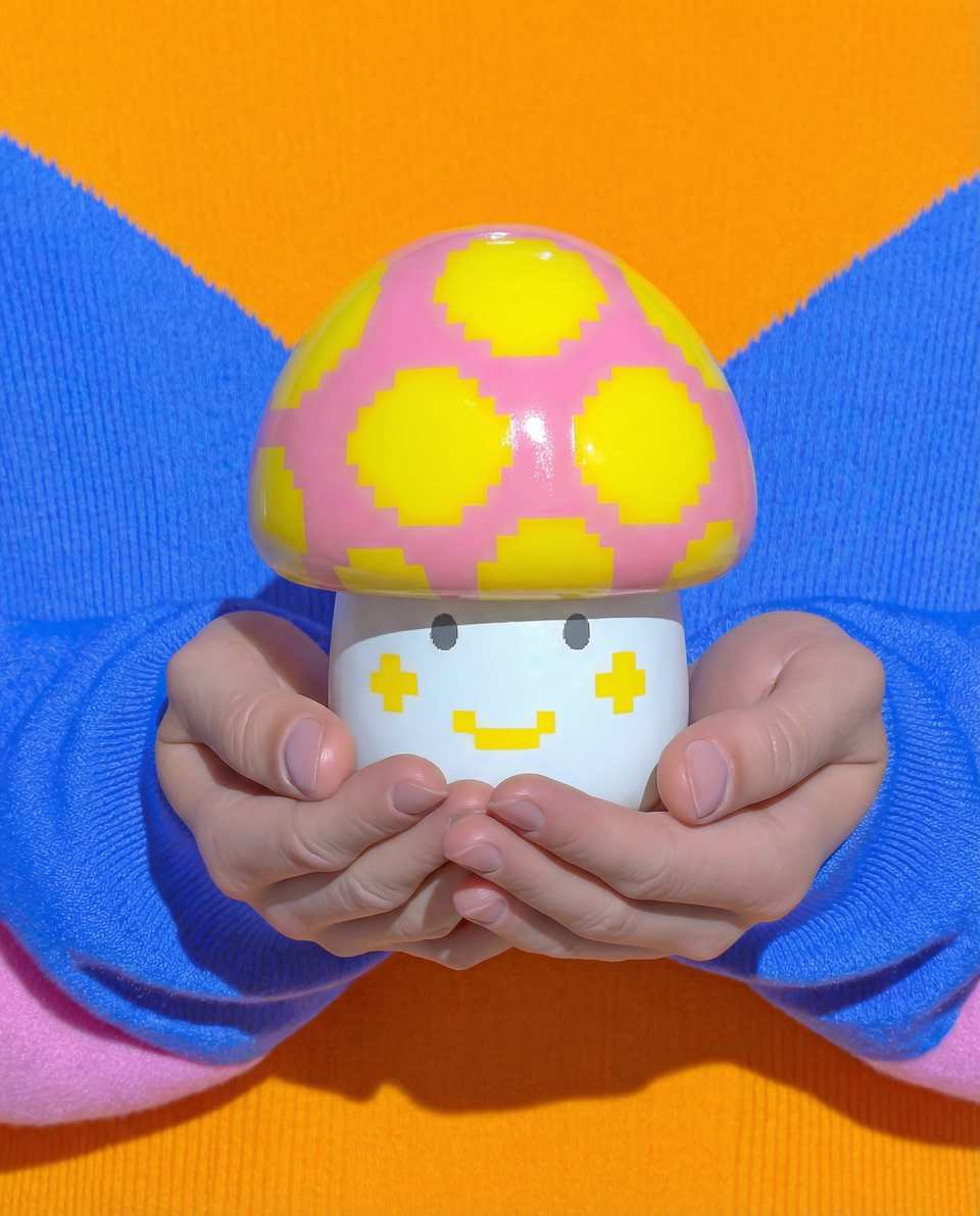 Polymer Clay Voxel Mushroom Desk Buddy Figurine shown in styled display context with object size and surface texture visible. Figurine using sculpting with a gloss sealant finish.