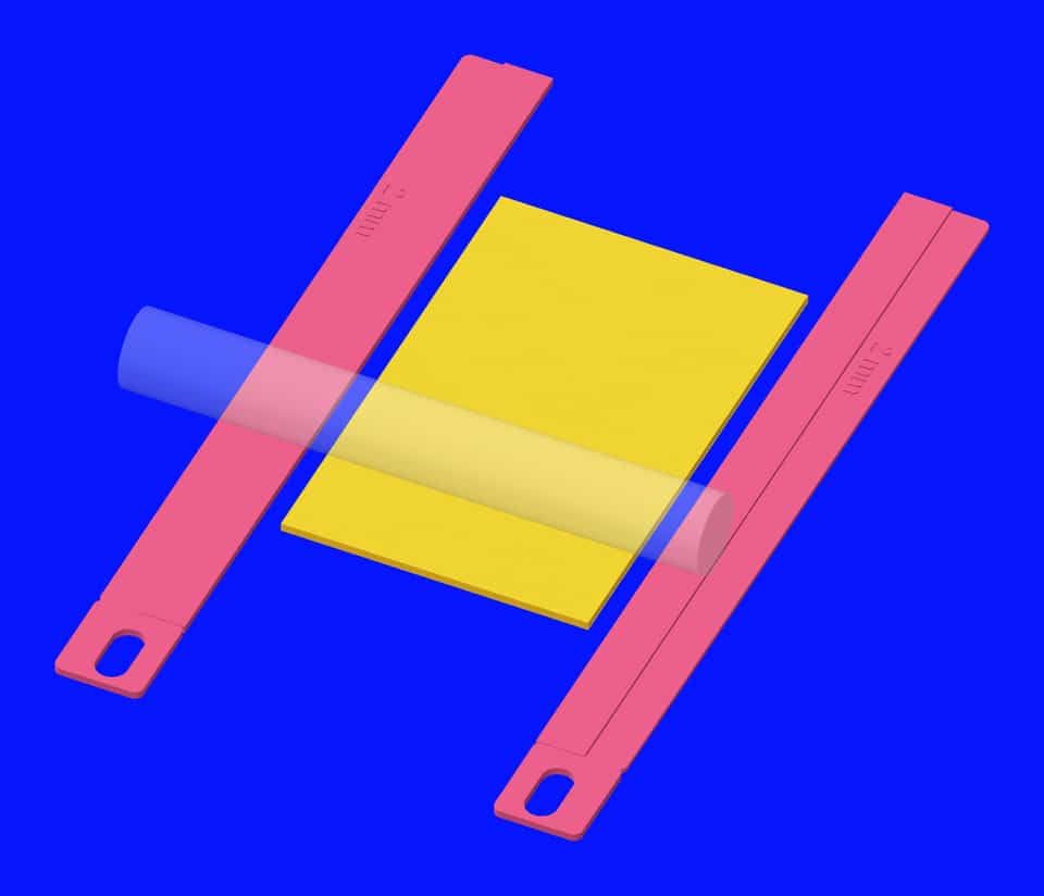 A yellow sheet between matching 2 mm pink guides.