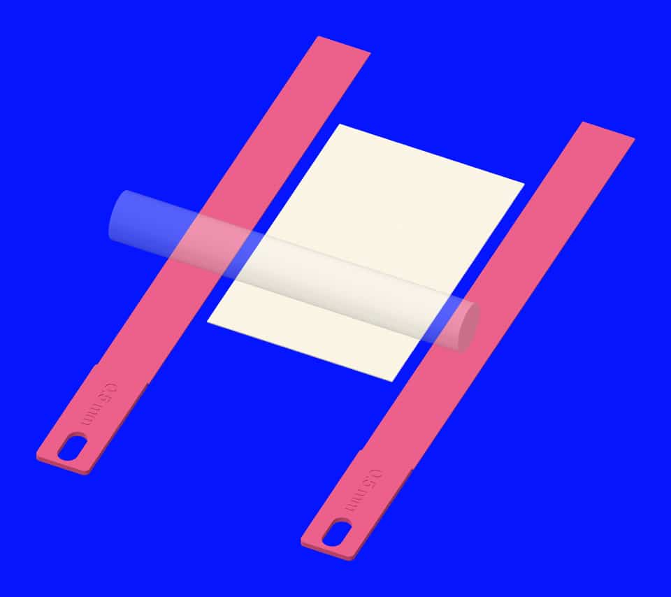 A white sheet between matching 0.5 mm pink guides.