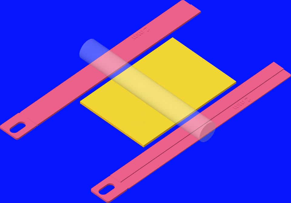 Pink 2 mm guides support a clear acrylic roller over yellow polymer clay.