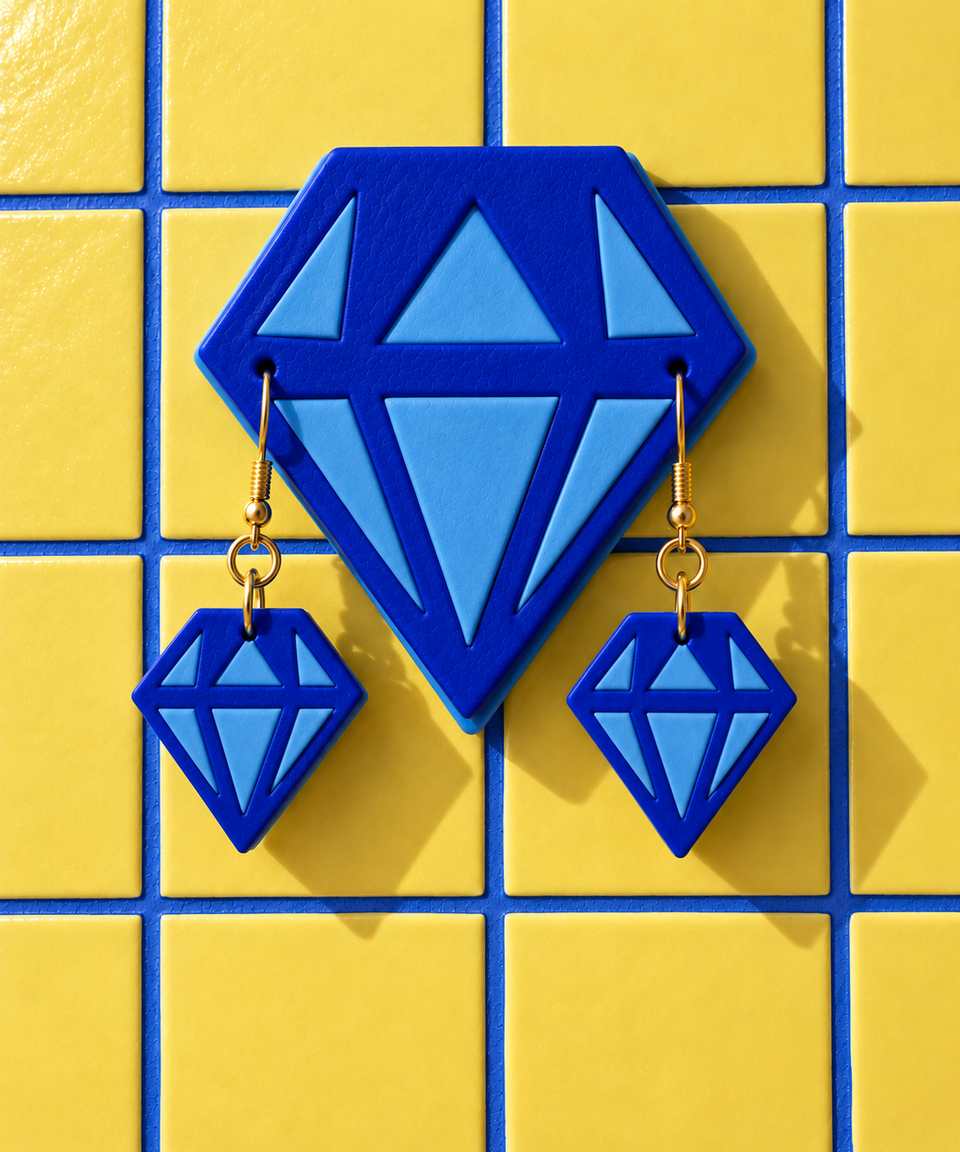 A blue and white wall display with matching drop earrings. Colours and room styling are examples; follow the guide for mounting.