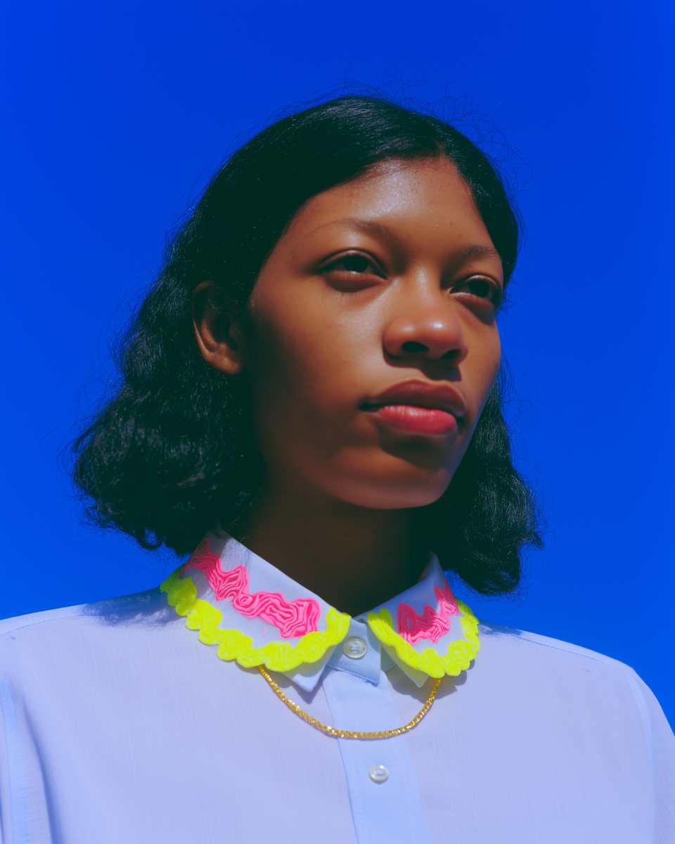 Polymer Clay Acid Yellow & Hot Pink Relief Scallop Collar Necklace shown in styled wear context with size, drape, and hardware visible. Slab cutting necklace, hand-finished with s…