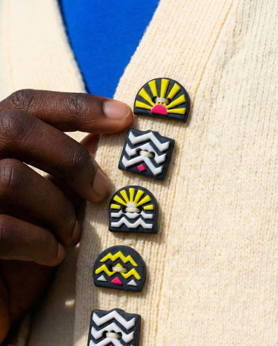 Black Polymer Clay & Neon Art Deco Button Set shown in styled display context with object size and surface texture visible. Slab cutting button, hand-finished with gloss sealant.