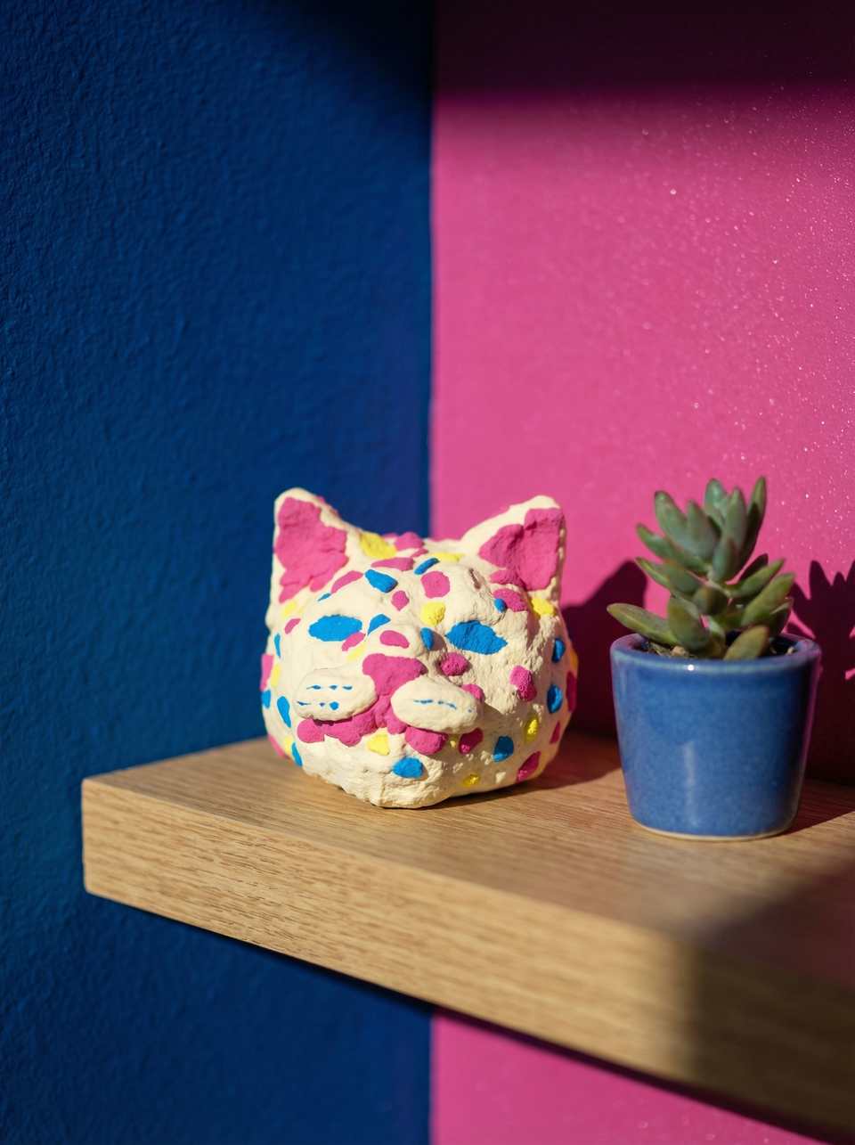 Cream Polymer Clay Terrazzo Cat Head Desk Buddy Figurine shown in styled display context with object size and surface texture visible. Handmade figurine using sculpting, finished…