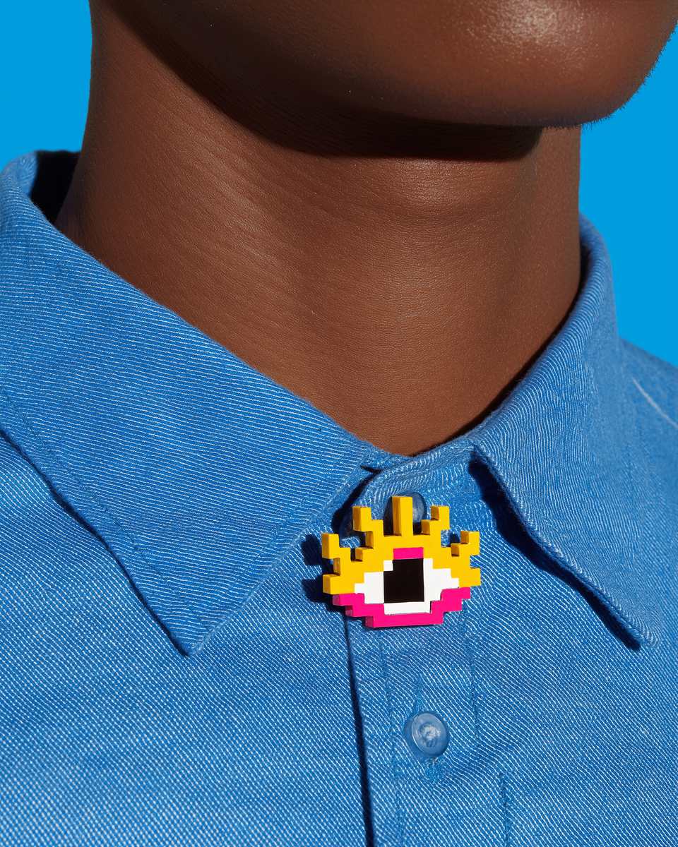 Yellow Polymer Clay Pixel Eye Pin shown in styled wear context with size, drape, and hardware visible. Pixel construction brooch, hand-finished with sanded buffed.