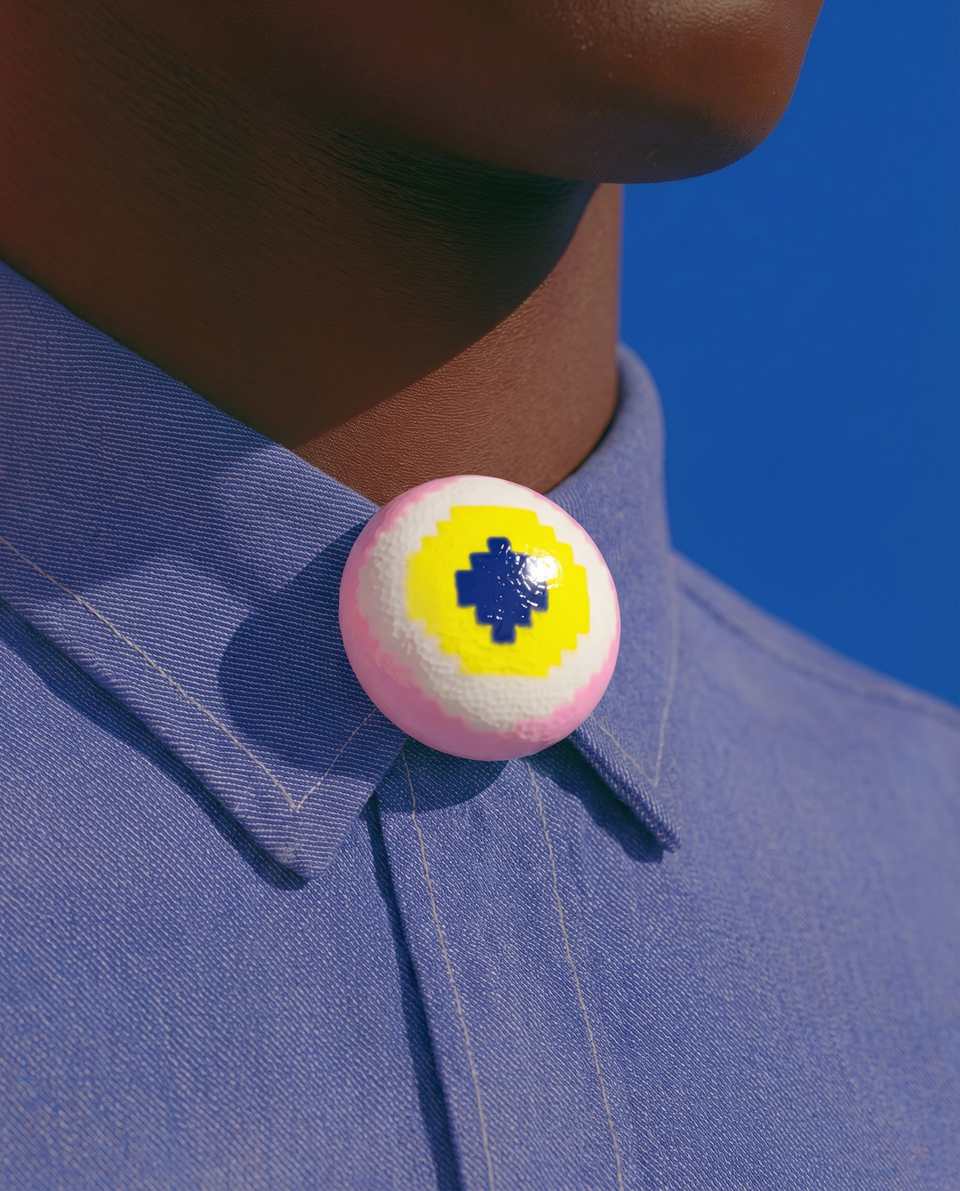Pink Polymer Clay & Yellow Pixel Eyeball Pin shown in styled wear context with size, drape, and hardware visible. Brooch handmade in pixel construction with gloss sealant finish.