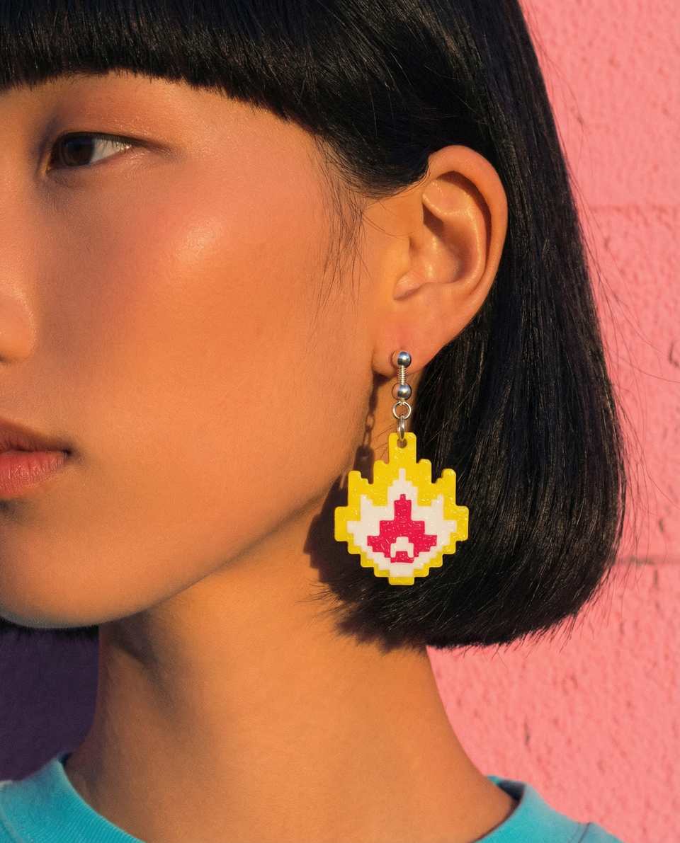 Yellow Polymer Clay Pixel Flame Dangle Earrings shown in styled wear context with size, drape, and hardware visible. Handmade earrings using pixel construction, finished with gloss sealant.
