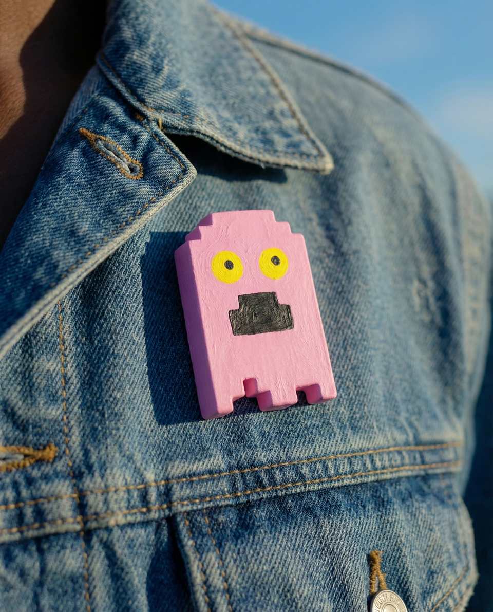 Pink Polymer Clay Pixel Ghost Pin shown in styled wear context with size, drape, and hardware visible. Handmade brooch using pixel construction, finished with matte sealant.