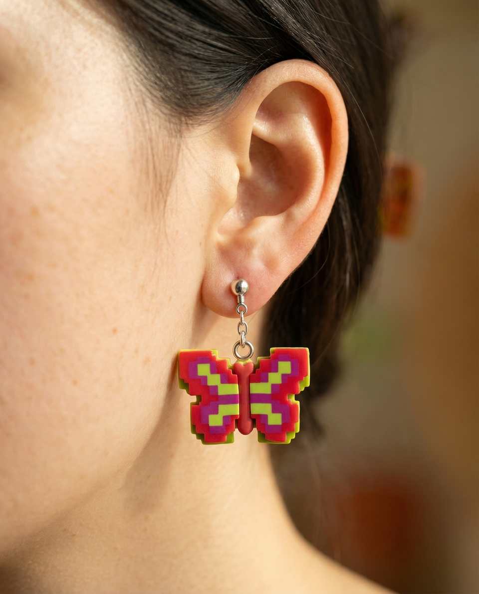 Polymer Clay Pixel Butterfly Statement Dangle Earrings shown in styled wear context with size, drape, and hardware visible. Handmade pixel construction earrings with sanded buffed…