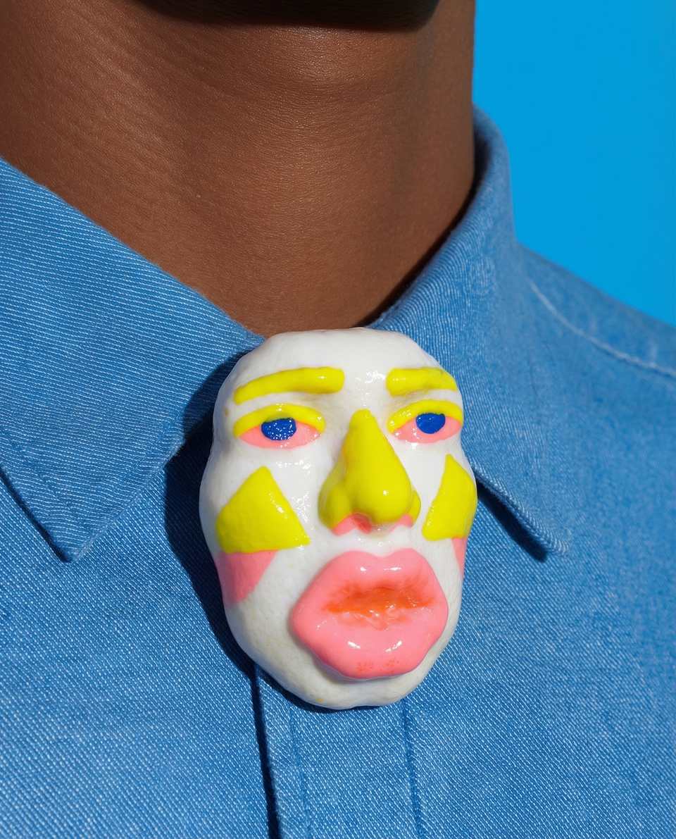 Polymer Clay Sculpted Theatre Face Pin shown in styled wear context with size, drape, and hardware visible. Handmade sculpting brooch with gloss sealant finish.