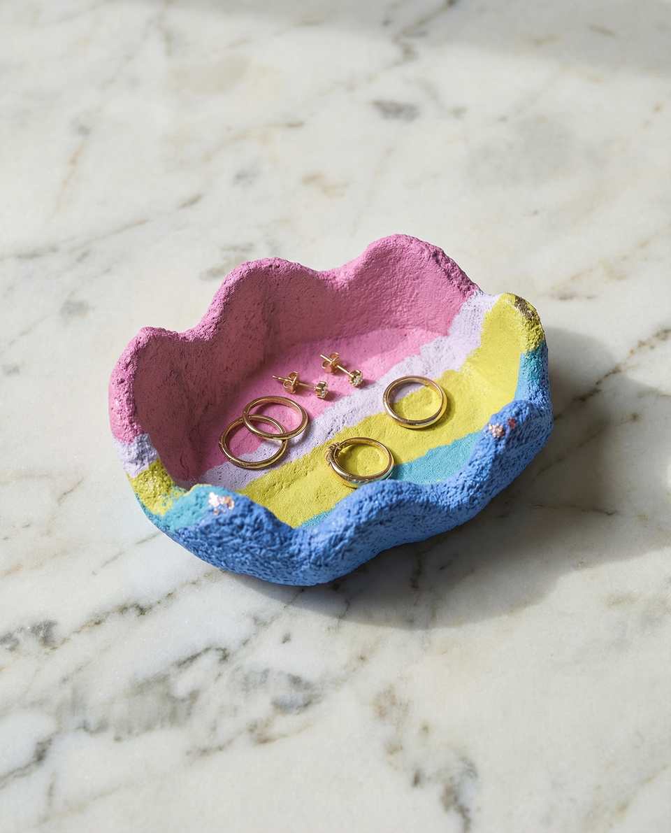 Striped pastel trinket dish used as a small ring catchall