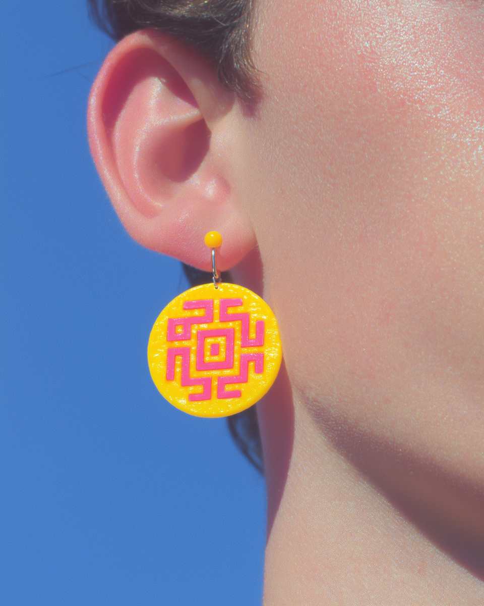 Yellow Polymer Clay Maze Disc Dangle Earrings shown in styled wear context with size, drape, and hardware visible. Handmade surface applique earrings with gloss sealant finish.