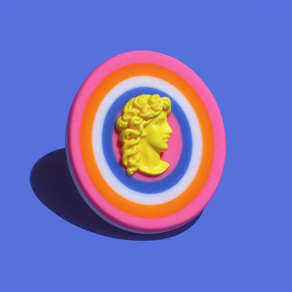 Polymer Clay Neon Pop Art Cameo Pin. Sculpting brooch, hand-finished with gloss sealant. Round medallion brooch with five concentric rings (hot-pink, orange, white, cobalt, center…