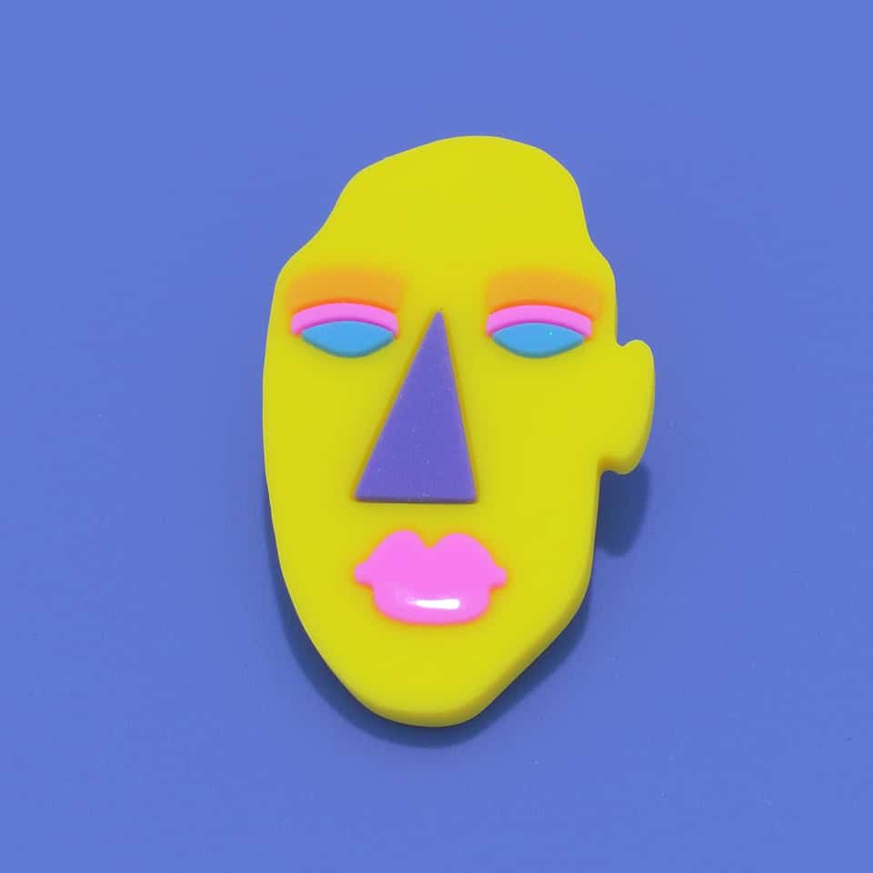 Polymer Clay Matisse-Style Abstract Face Pin. Handmade slab cutting brooch with matte sealant finish. Low-relief face plaque cut from an acid-yellow slab. Lock the long face shape…