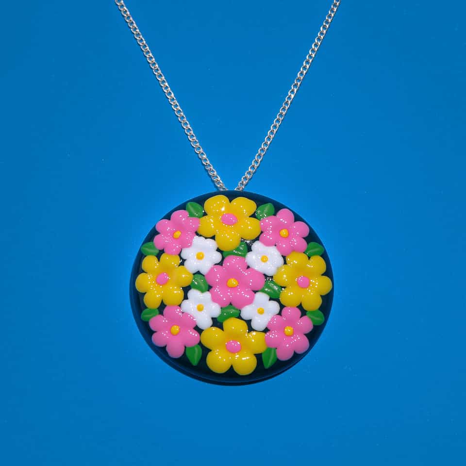 Polymer Clay Glossy Pietra Dura Floral Applique Necklace. Pendant handmade in sculpting with gloss sealant finish. Build a flat dark-navy or black disc, then build each two-tone f…
